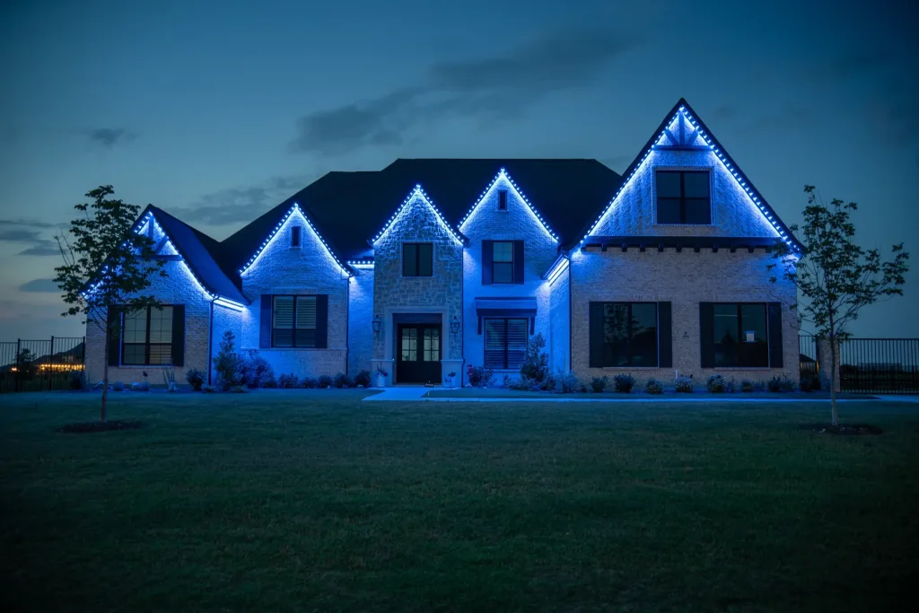 Large home outlined in blue LED Bosso Smart Lighting for permanent lighting display