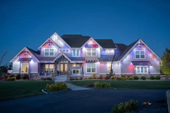 Large estate home fully lit with Bosso Smart Lighting in patriotic red white and blue