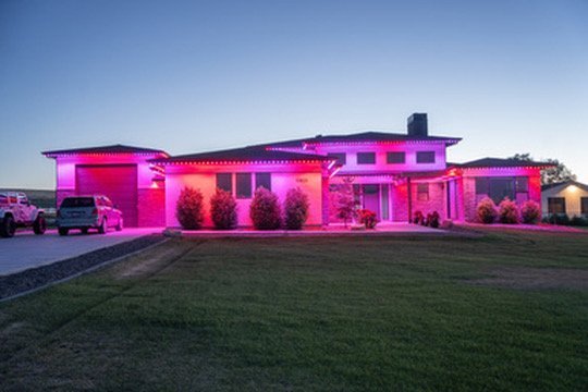 Red and pink lighting on a modern home by Bosso Smart Lights