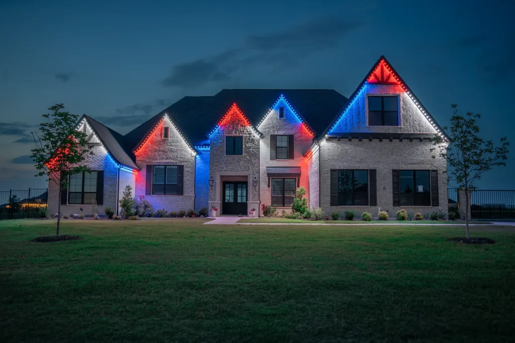 Home with red white and blue roofline lighting from Bosso Smart Lighting