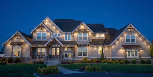 Modern home exterior with white Bosso Smart Lights along the roofline