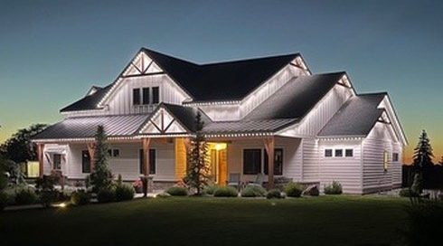 Craftsman home with white Bosso Lighting at dusk