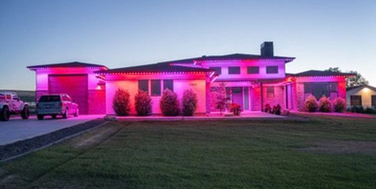 Red and pink lighting on a modern home by Bosso Smart Lights